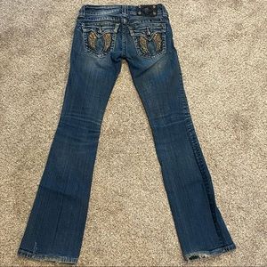 SOLD - Miss Me Boot cut Jeans 24 x 32. Wing detail on pockets